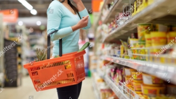 stock photo sale shopping consumerism and people concept woman with food basket at grocery store or